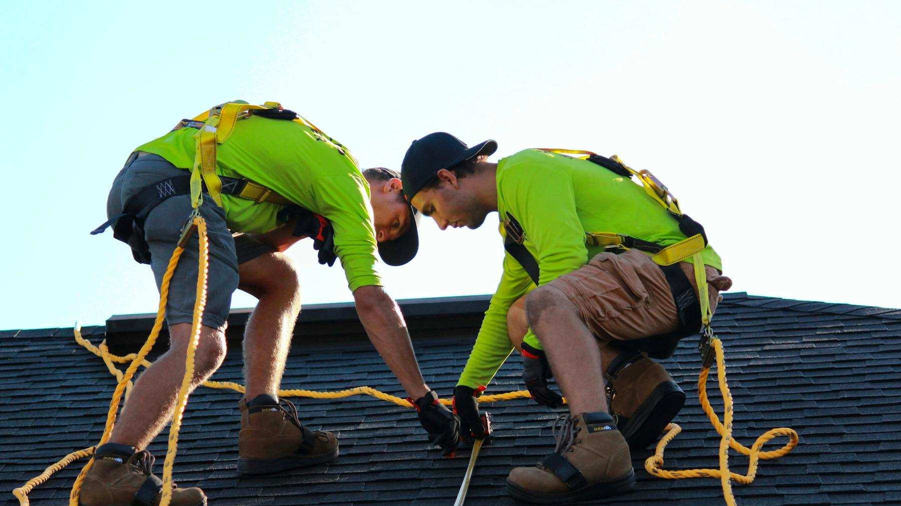 Installers working on a residential roof